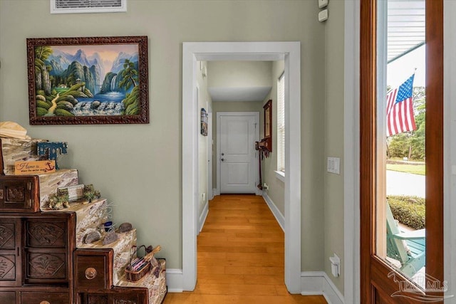 hall with light hardwood / wood-style floors