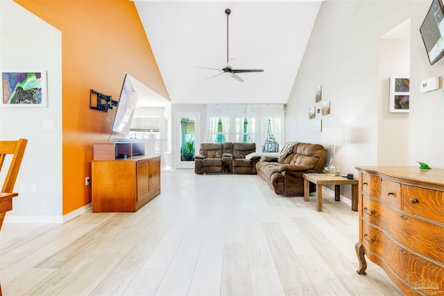 7543 Loop St, Navarre, FL 32566 - living room featuring high vaulted ceiling, a ceiling fan, and light wood-type flooring