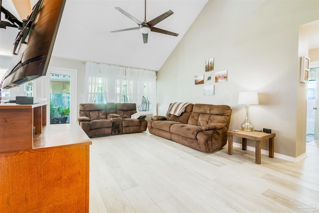 7543 Loop St, Navarre, FL 32566 - living area with high vaulted ceiling, a ceiling fan, and light wood-style flooring