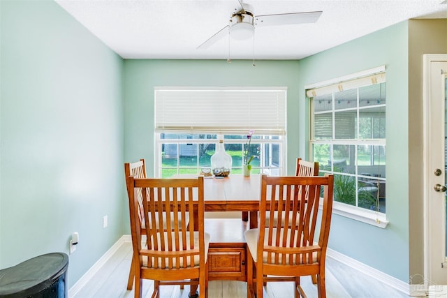 7543 Loop St, Navarre, FL 32566 - dining room with ceiling fan and wood finished floors