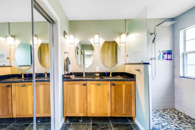 7543 Loop St, Navarre, FL 32566 - bathroom featuring a walk in shower and double vanity