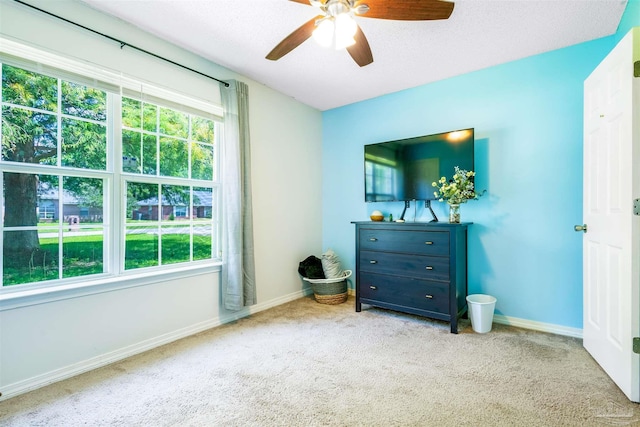 7543 Loop St, Navarre, FL 32566 - carpeted bedroom with baseboards and a ceiling fan
