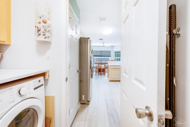7543 Loop St, Navarre, FL 32566 - laundry area with washer / clothes dryer and light wood-style floors
