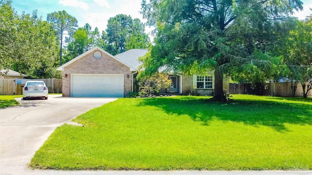 7543 Loop St, Navarre, FL 32566 - view of front of home with brick siding, driveway, and a garage