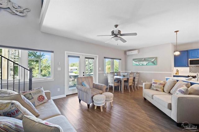 living room with dark hardwood / wood-style floors, ceiling fan, and french doors