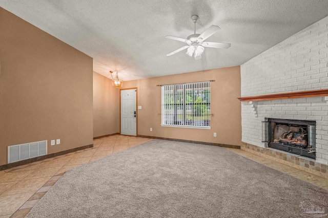2931 Pine Forest Rd, Cantonment, FL 32533 - unfurnished living room featuring a textured ceiling, tile patterned flooring, a fireplace, a ceiling fan, and baseboards