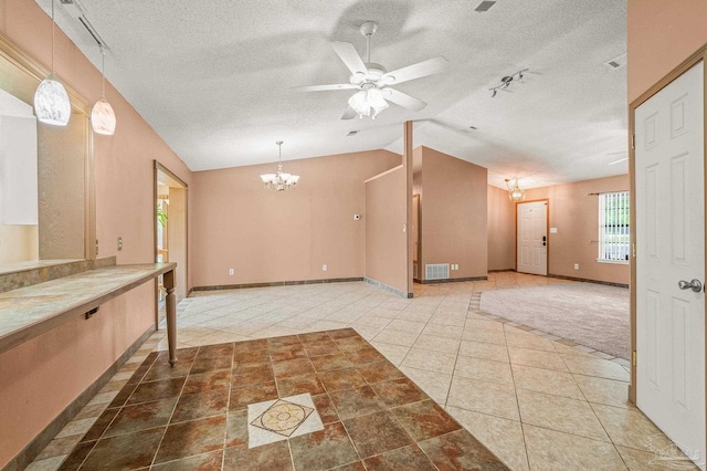 2931 Pine Forest Rd, Cantonment, FL 32533 - kitchen with a chandelier, lofted ceiling, a ceiling fan, a textured ceiling, and tile patterned floors