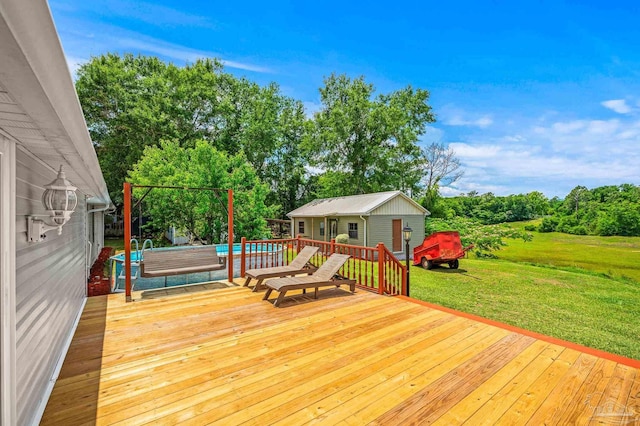 2931 Pine Forest Rd, Cantonment, FL 32533 - wooden terrace featuring a yard, an outdoor pool, view of scattered trees, and an outbuilding