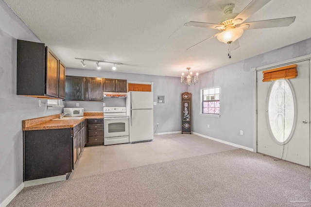 2931 Pine Forest Rd, Cantonment, FL 32533 - kitchen with white appliances, a chandelier, under cabinet range hood, ceiling fan, and light countertops