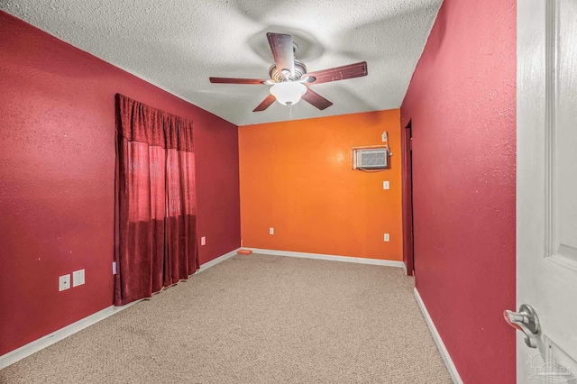 2931 Pine Forest Rd, Cantonment, FL 32533 - carpeted empty room featuring ceiling fan, a wall mounted AC, a textured ceiling, and baseboards