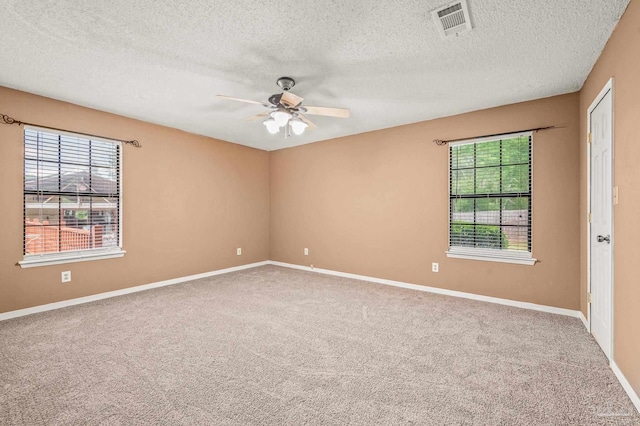 2931 Pine Forest Rd, Cantonment, FL 32533 - carpeted empty room featuring a ceiling fan, a textured ceiling, and baseboards