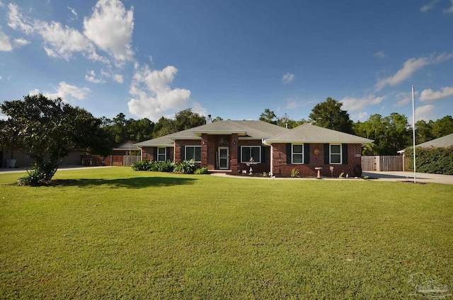 single story home with a front lawn