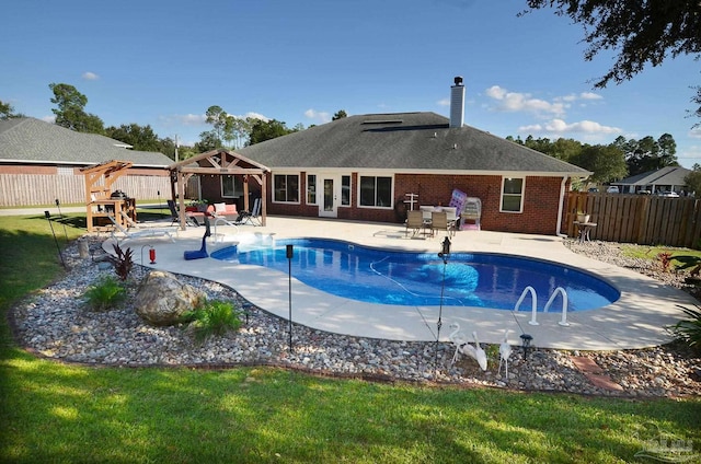 view of pool with a lawn, a patio, and a gazebo