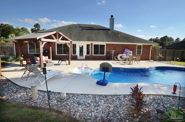 view of swimming pool with a patio area