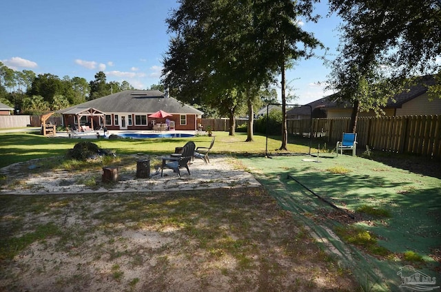 view of yard with a patio and a pool