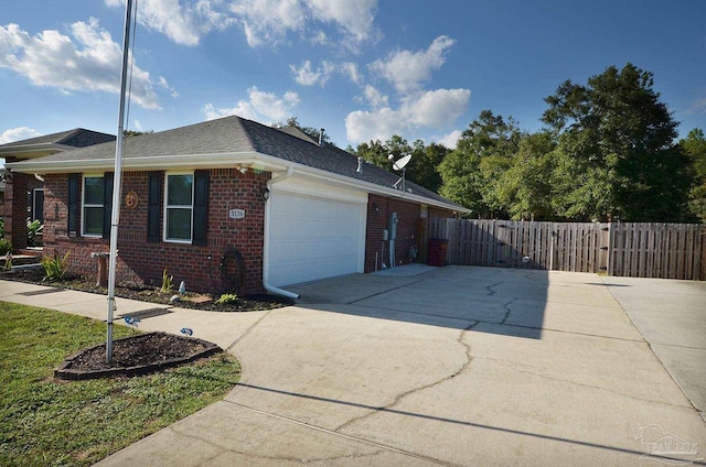 view of side of home featuring a garage