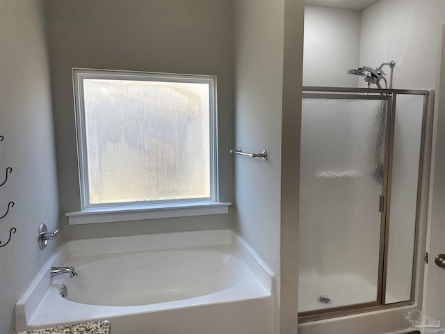 bathroom featuring plus walk in shower