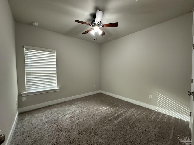 empty room with carpet floors and ceiling fan