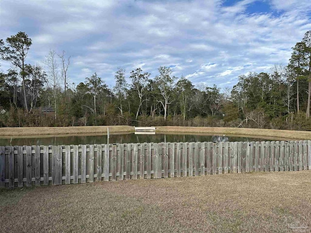 view of yard featuring a water view and radiator