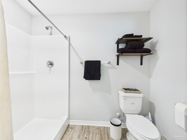 430 Morris Ave, Cantonment, FL 32533 - full bathroom featuring a shower, wood finished floors, and toilet