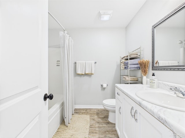 430 Morris Ave, Cantonment, FL 32533 - full bathroom with toilet, vanity, wood finished floors, baseboards, and shower / bathtub combination with curtain