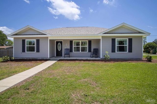 430 Morris Ave, Cantonment, FL 32533 - ranch-style home with a front yard, covered porch, and roof with shingles