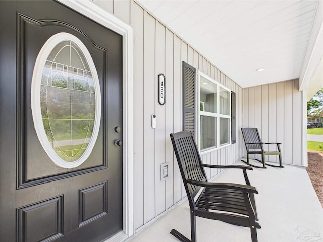 430 Morris Ave, Cantonment, FL 32533 - property entrance featuring covered porch and board and batten siding