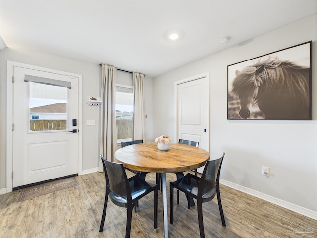 430 Morris Ave, Cantonment, FL 32533 - dining space featuring light wood-type flooring and baseboards