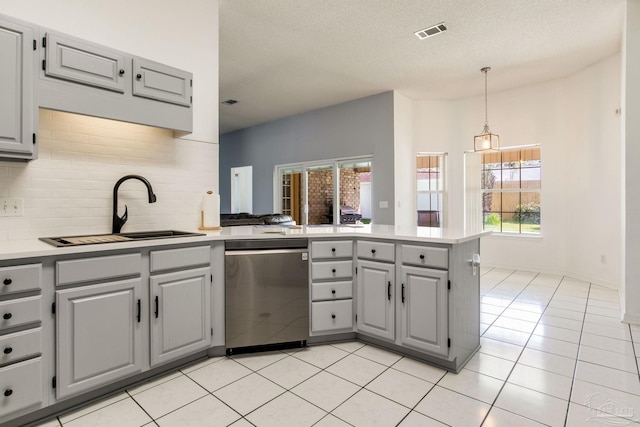 2405 Ursula Ln, Pensacola, FL 32526 - kitchen with visible vents, dishwasher, a sink, a peninsula, and gray cabinets