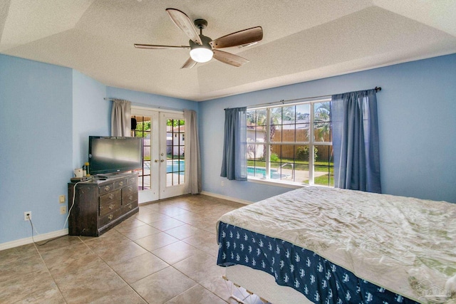 2405 Ursula Ln, Pensacola, FL 32526 - bedroom with baseboards, ceiling fan, a textured ceiling, french doors, and access to exterior