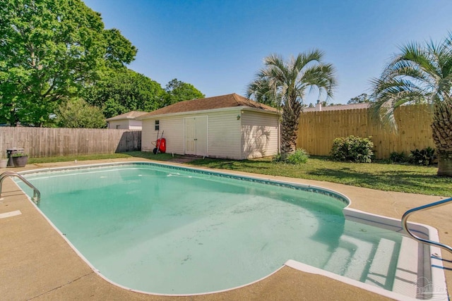 2405 Ursula Ln, Pensacola, FL 32526 - view of swimming pool with a lawn, a fenced backyard, an outdoor structure, a storage unit, and a fenced in pool