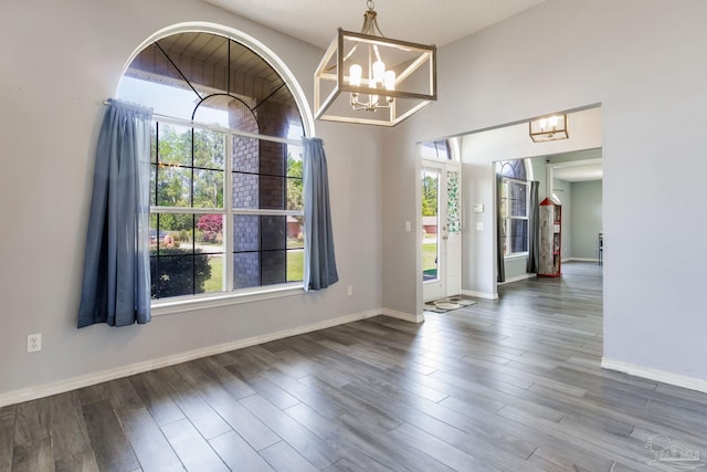 2405 Ursula Ln, Pensacola, FL 32526 - unfurnished dining area with plenty of natural light, an inviting chandelier, and wood finished floors