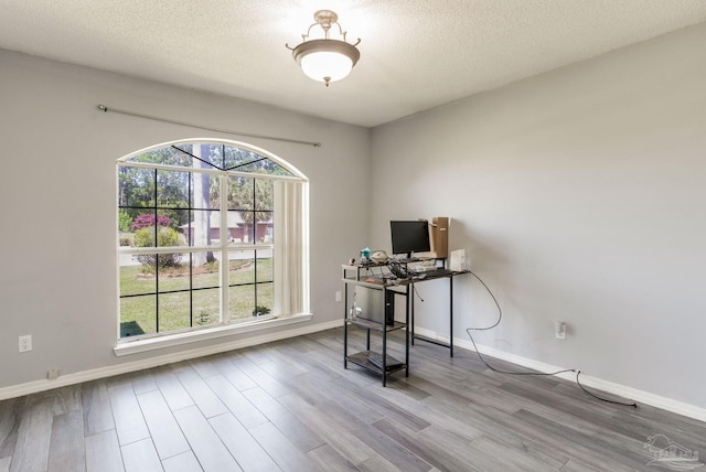 2405 Ursula Ln, Pensacola, FL 32526 - home office with baseboards, wood finished floors, and a textured ceiling