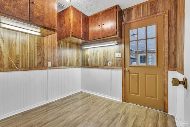 465 Man O War Cir, Cantonment, FL 32533 - entryway featuring light wood-style flooring and wood walls