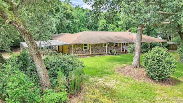 465 Man O War Cir, Cantonment, FL 32533 - ranch-style house featuring a front lawn, stone siding, and a view of trees