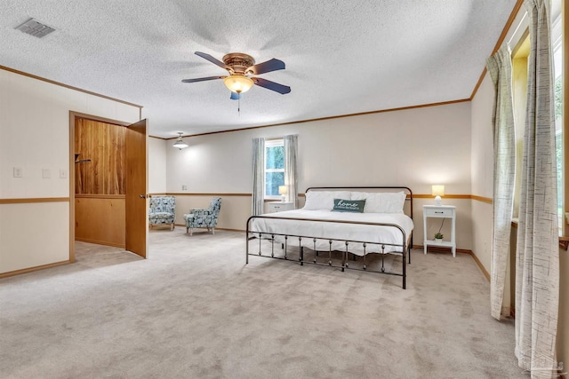 465 Man O War Cir, Cantonment, FL 32533 - bedroom with crown molding, carpet, a textured ceiling, and a ceiling fan