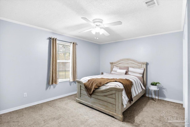 carpeted bedroom featuring ornamental molding, visible vents, and baseboards