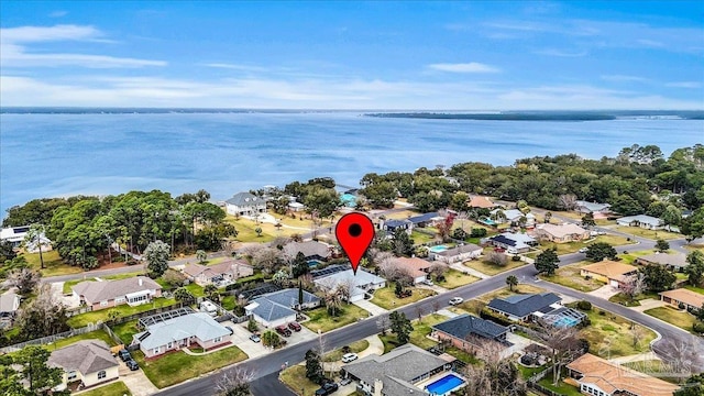 birds eye view of property featuring a water view and a residential view