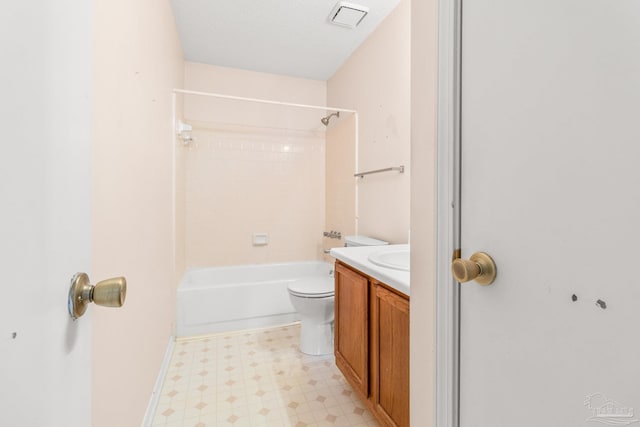 full bathroom featuring shower / bathtub combination, toilet, a textured ceiling, and vanity