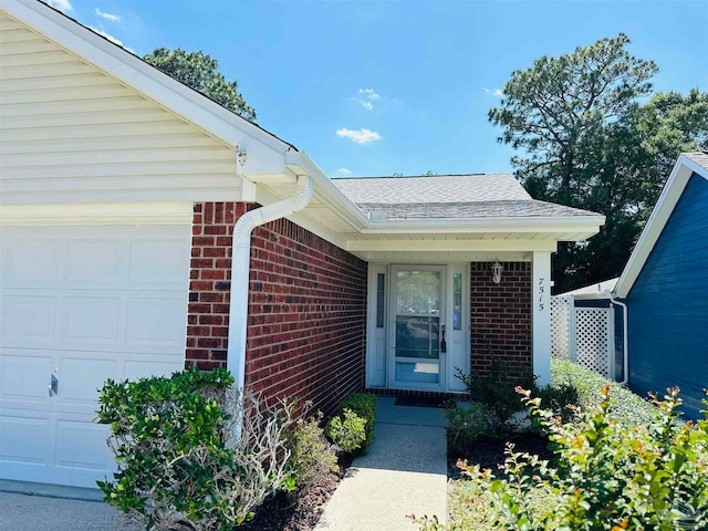 entrance to property featuring a garage