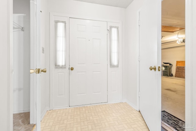 foyer with a textured ceiling