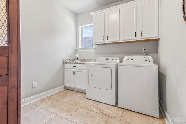 2120 Eagles Ridge Cv, Cantonment, FL 32533 - clothes washing area with cabinet space, independent washer and dryer, baseboards, and light tile patterned floors