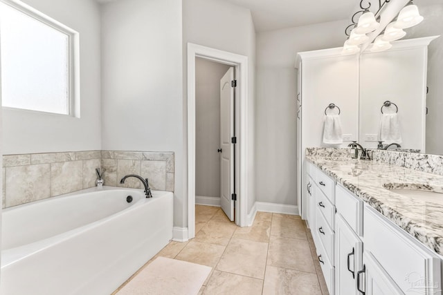 2120 Eagles Ridge Cv, Cantonment, FL 32533 - full bath featuring a bath, double vanity, baseboards, and tile patterned flooring