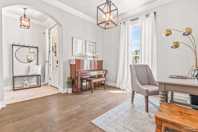 2120 Eagles Ridge Cv, Cantonment, FL 32533 - office with arched walkways, a chandelier, wood finished floors, ornamental molding, and baseboards