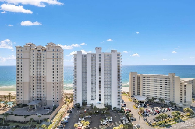 birds eye view of property with a beach view and a water view