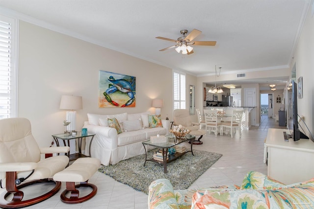 tiled living room with crown molding and ceiling fan