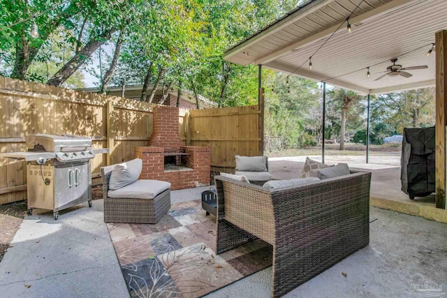 view of patio with an outdoor living space with a fireplace, a grill, and ceiling fan