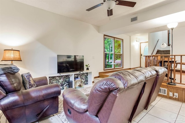 living area featuring visible vents, a ceiling fan, and light tile patterned flooring