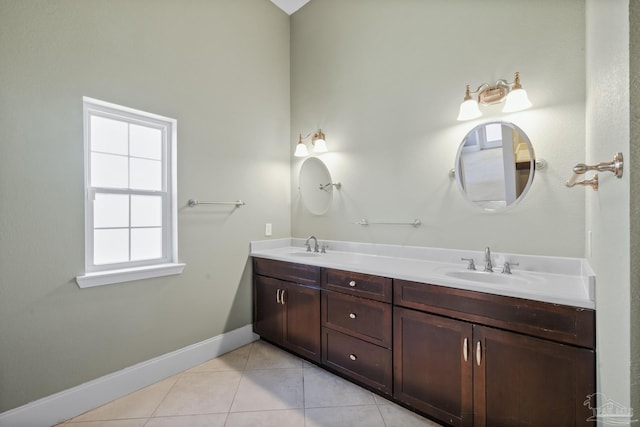 bathroom with tile patterned flooring and vanity