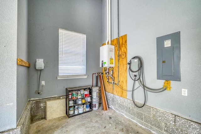 utility room featuring electric panel and water heater